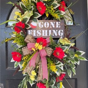 Festive Floral Fishing Wreath with Red Accents